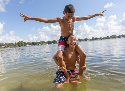 Picture of two boys playing in the lake